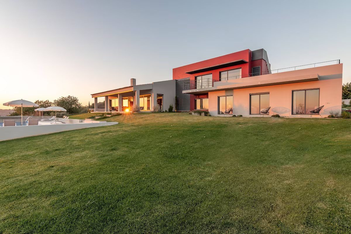 Algarve Esencial villa exterior at sunset, with the pool terrace