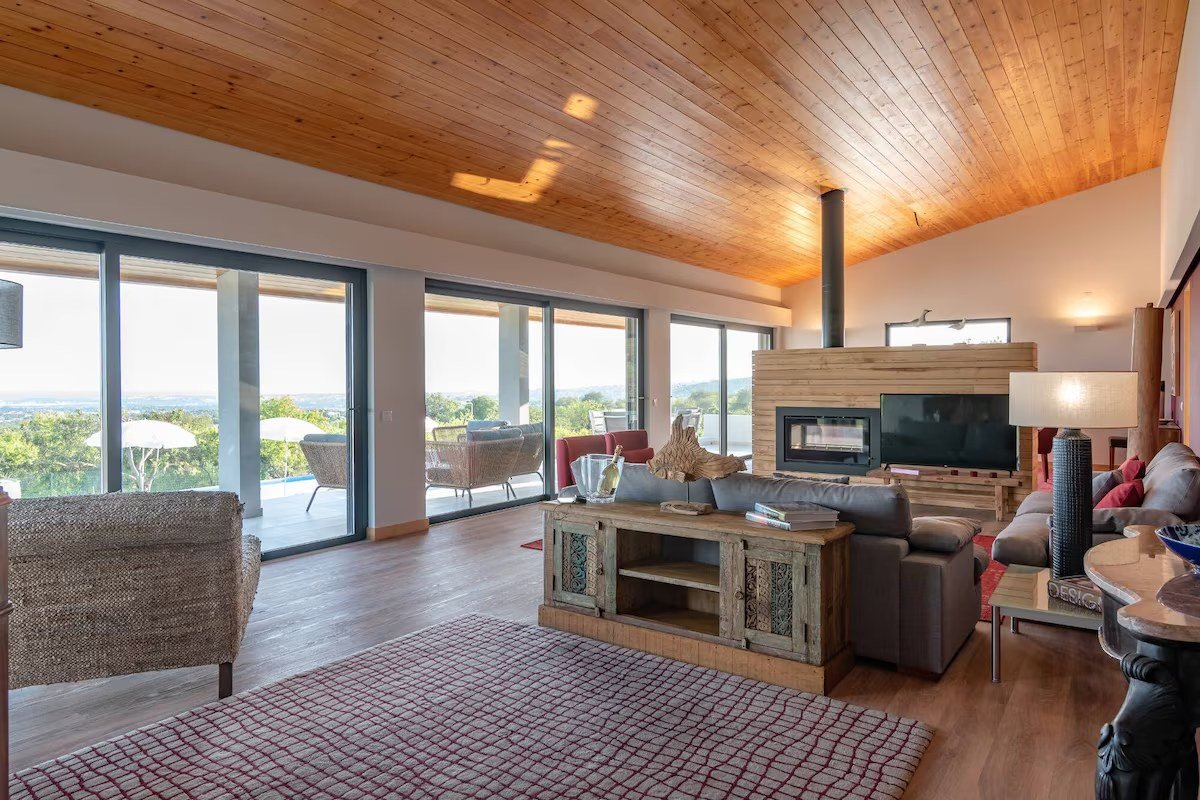 Living room at Algarve Esencial with a wood-clad ceiling and panoramic views