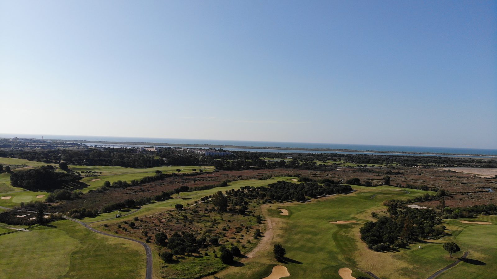 Aerial view of El Rompido golf course and the Huelva coast