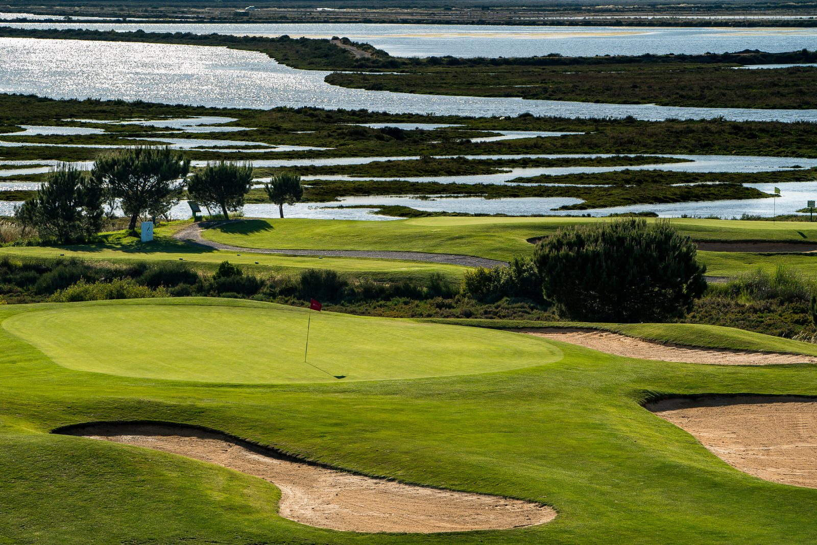 El Rompido golf green with bunkers overlooking the marshland