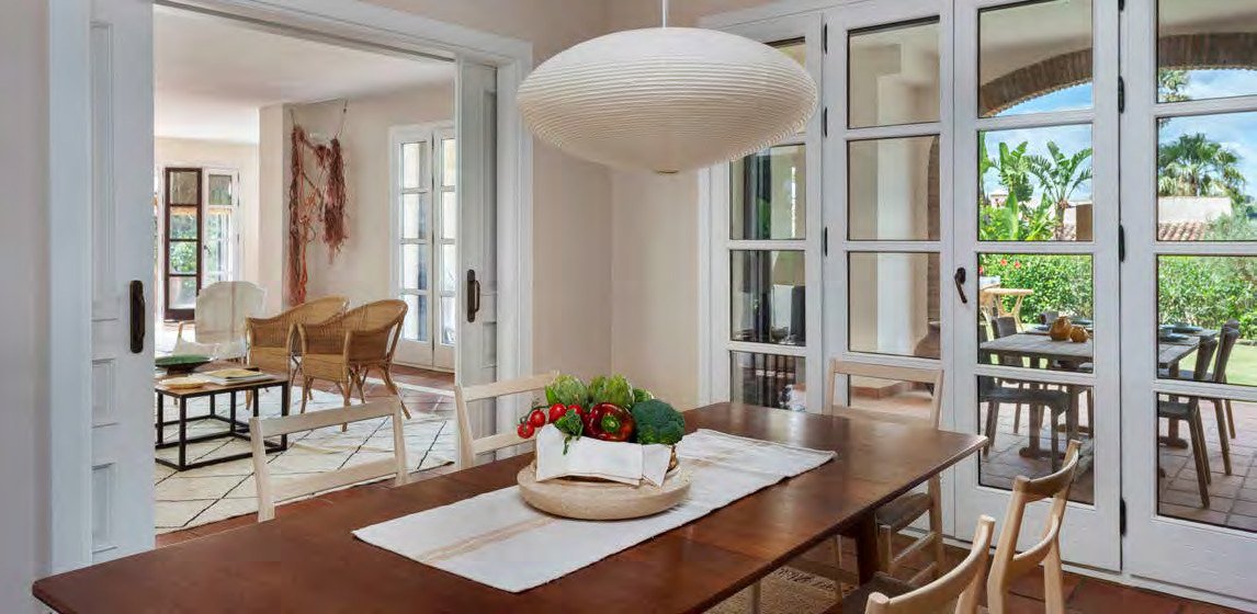 Dining room at Cortijo Lirio de Noche, opening onto the garden terrace