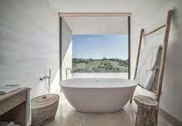 Bathroom at Villa La Escondida with a freestanding tub and countryside views